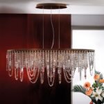 Candelabru de tavan KRISTALLDESIGN în formă ovală, 110x25cm, 10 lumini G9, alama solida finisaj alamă antica patinata, pandantive de cristal Schoeler ORION